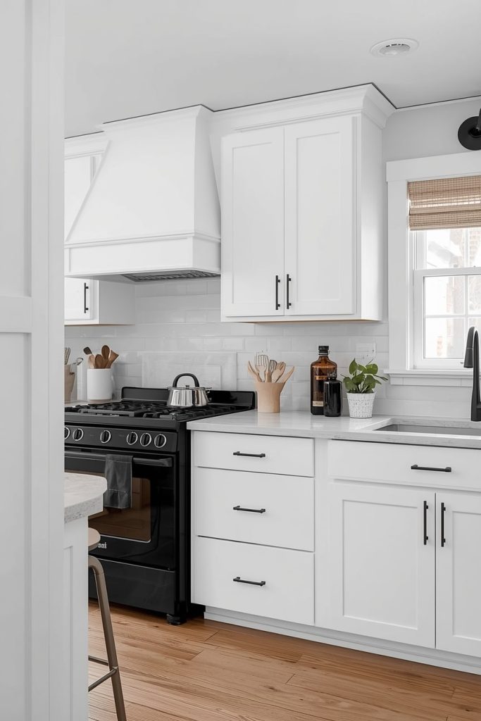 Black Hardware Farmhouse Kitchen With White Cabinets