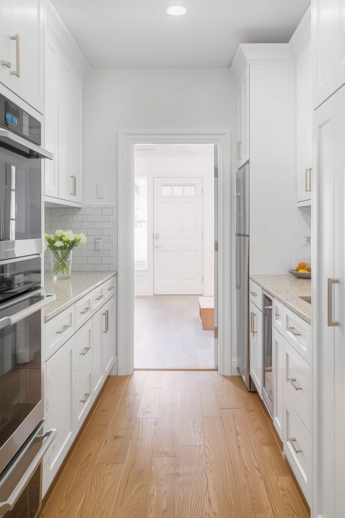 Small White Kitchen with Wood Floors That Feels Bigger